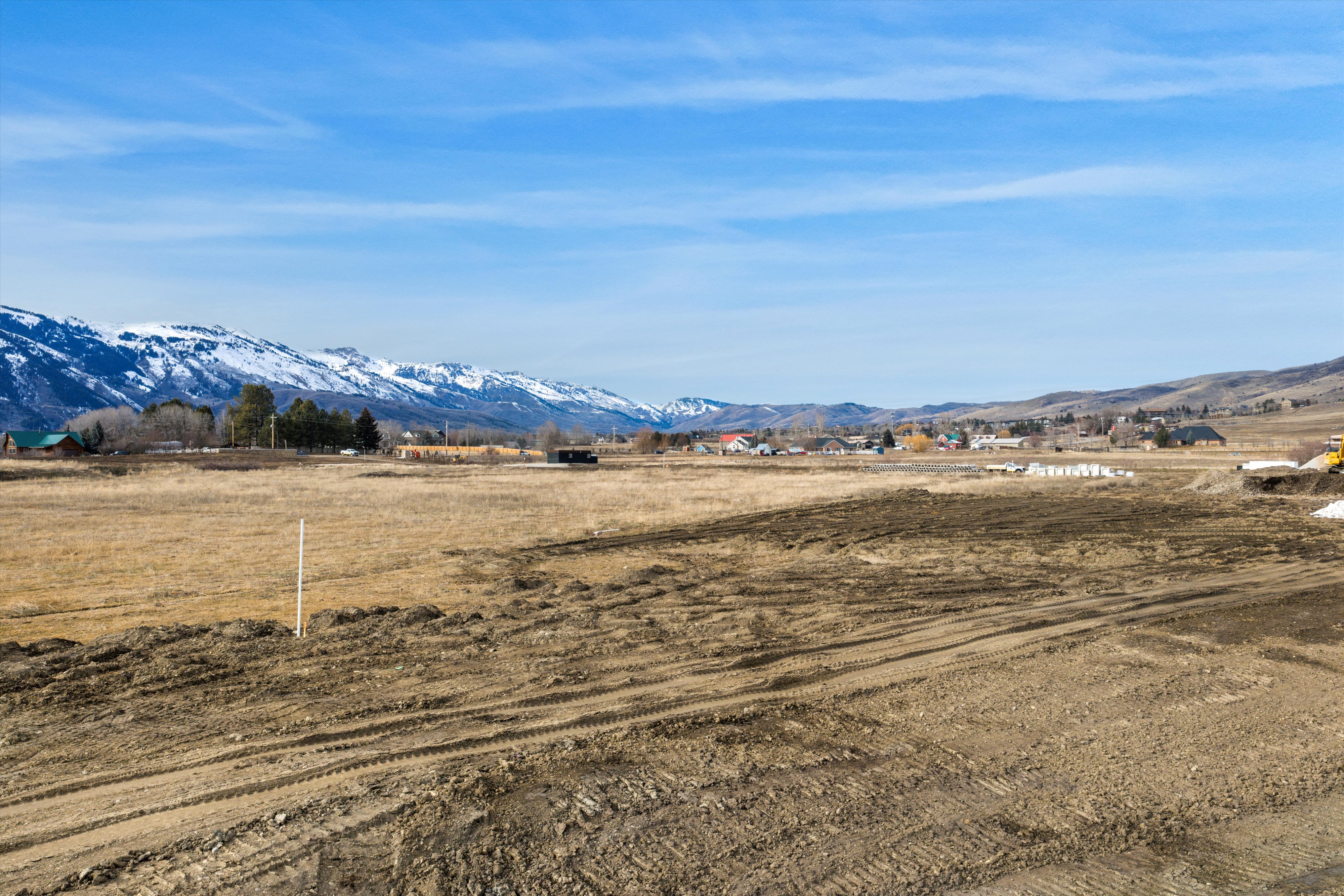 View of mountain backdrop with rural landscape