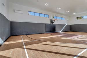 View of sport court with community basketball court and healthy amount of natural light