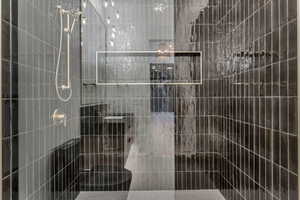 Full bathroom with a shower stall