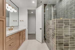 Bathroom with vanity, recessed lighting, walk in shower, and light tile patterned floors