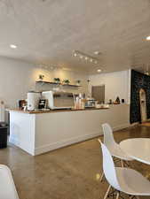 Dining room with recessed lighting and baseboards