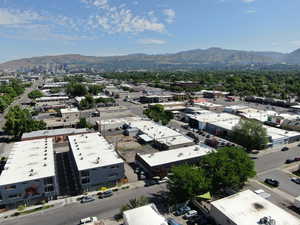 Aerial overview of property's location featuring a mountain backdrop