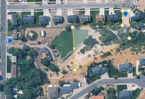 Aerial view of property's location featuring property boundaries highlighted and nearby suburban area