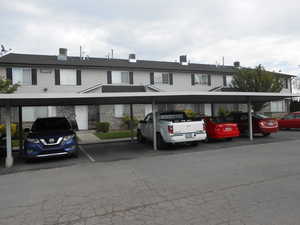 View of front of property with covered parking