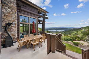 View of patio / terrace featuring outdoor dining space and a mountain view