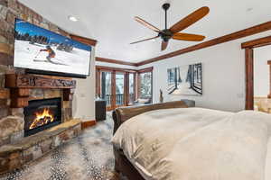 Bedroom with a fireplace, ornamental molding, access to outside, ceiling fan, and recessed lighting