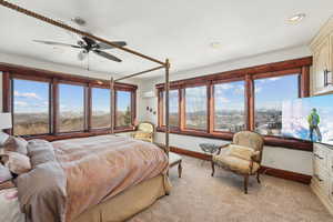 Bedroom featuring ceiling fan, light colored carpet, and recessed lighting