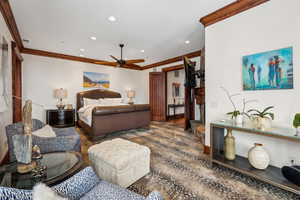 Bedroom with crown molding and recessed lighting