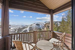 Wooden deck featuring a mountain view
