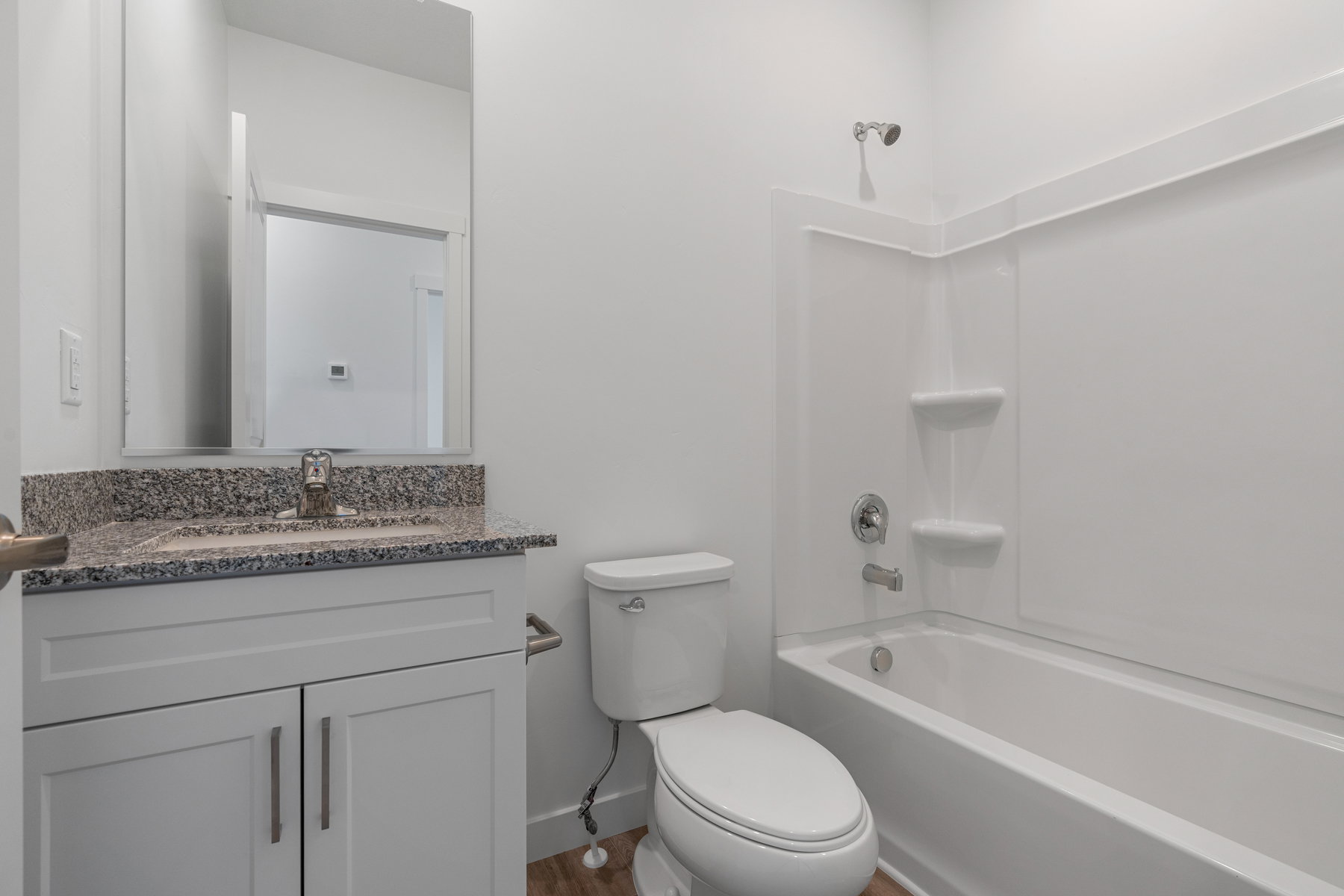 Full bath with vanity and shower / washtub combination