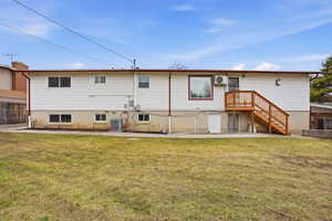 Back of property featuring brick siding and a patio