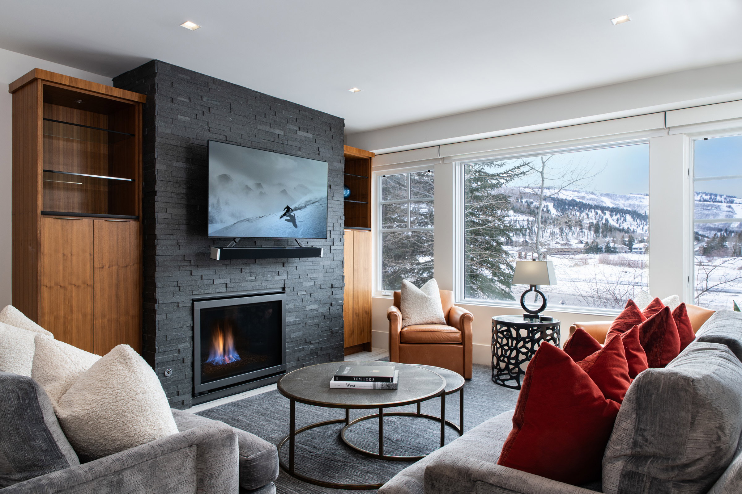 Living room with a stone fireplace