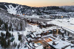 Snowy aerial view featuring a mountain view