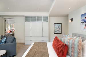 Bedroom featuring carpet and a closet