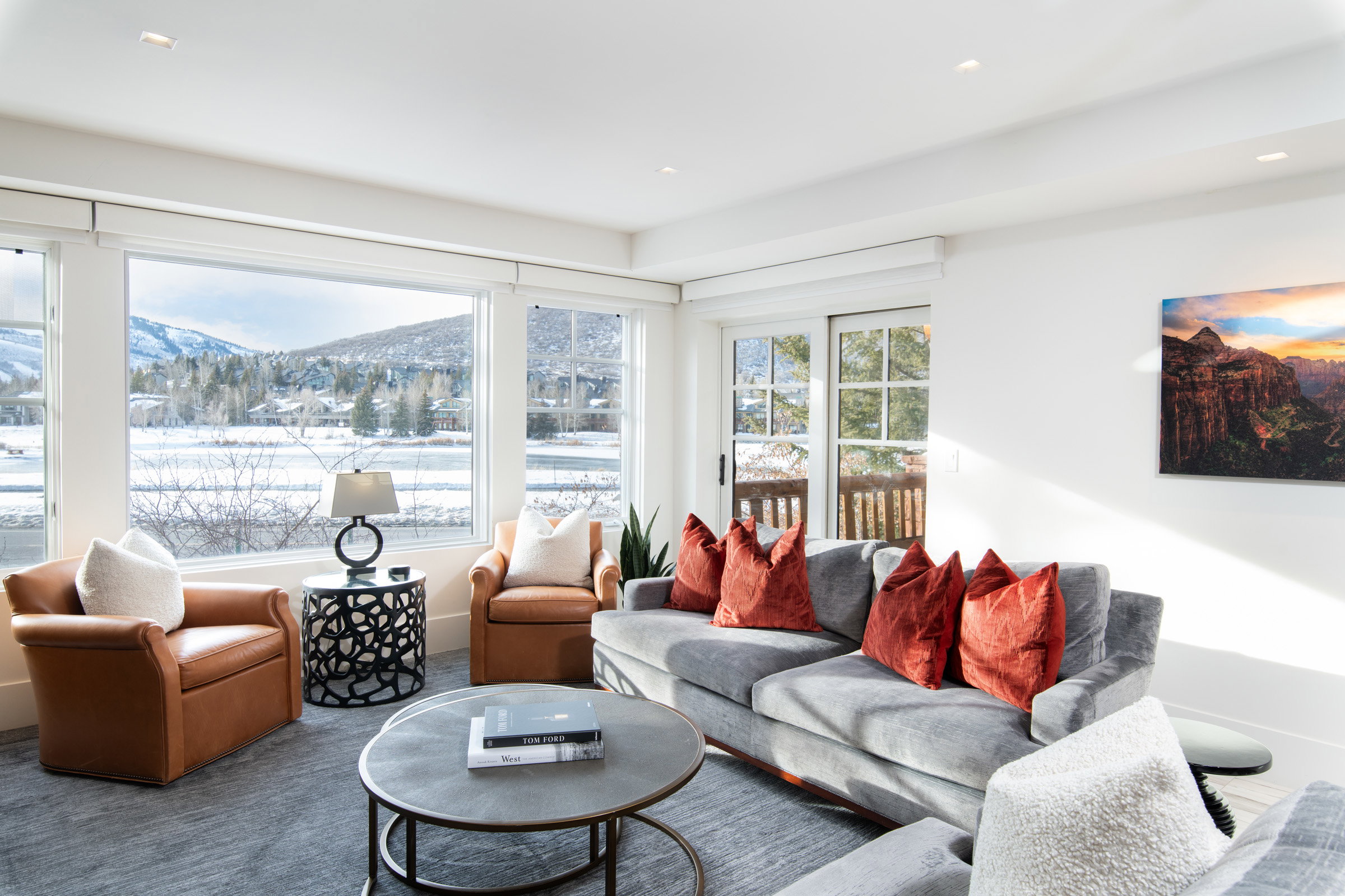 Carpeted living room with a mountain view and recessed lighting