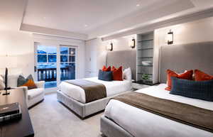Carpeted bedroom featuring access to exterior