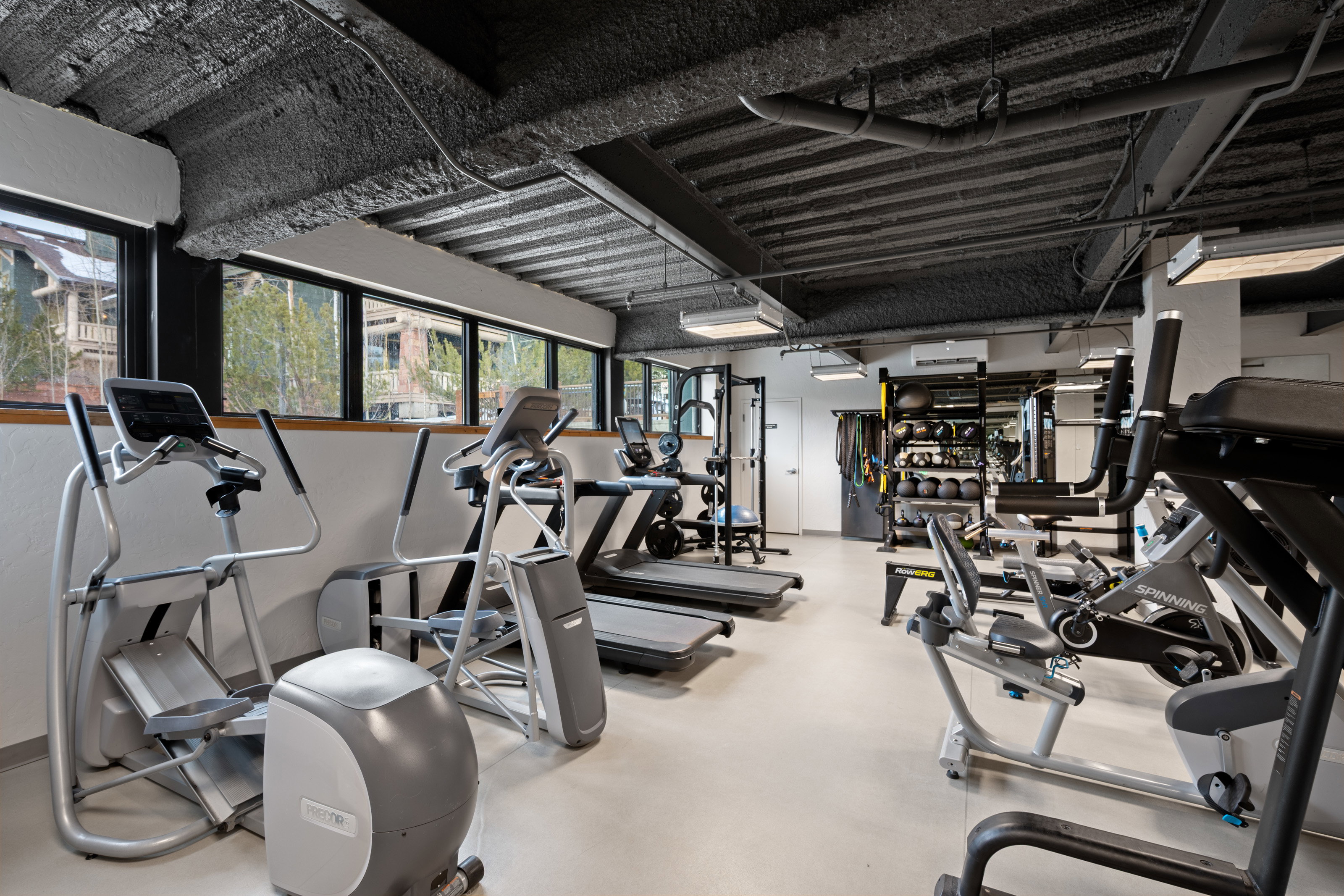 Workout area featuring a wall mounted mini split