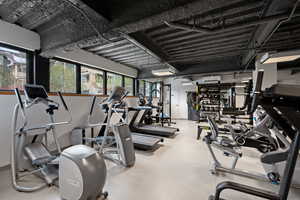 Workout area featuring a wall mounted mini split