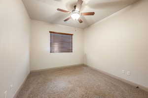 Unfurnished room with a ceiling fan and a textured ceiling