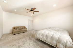 Bedroom featuring carpet flooring, ceiling fan, and recessed lighting