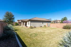 Fenced backyard with a patio area