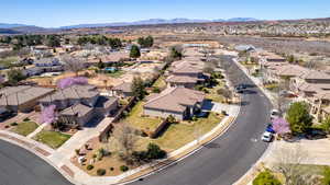 Aerial perspective of suburban area featuring a mountain backdrop