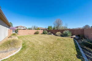 View of fenced backyard