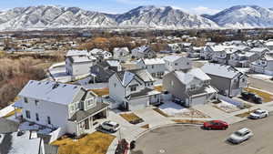 Aerial perspective of suburban area featuring a mountainous background