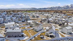 Aerial perspective of suburban area featuring a mountain backdrop