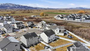 Aerial view of residential area featuring a mountainous background