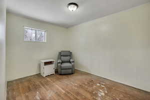 Unfurnished room with hardwood / wood-style flooring and ornamental molding