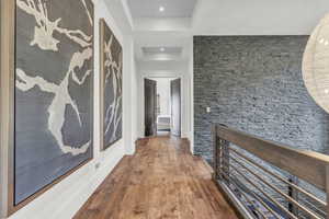 Hallway featuring dark wood-style flooring and recessed lighting