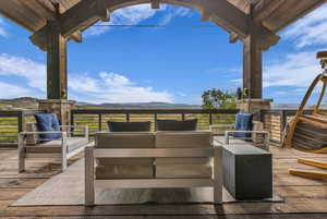Deck featuring a mountain view and outdoor lounge area