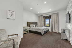 Bedroom with recessed lighting and dark colored carpet