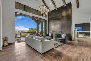 Living area featuring a fireplace, hardwood / wood-style floors, and recessed lighting