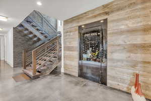 Wine cellar featuring concrete floors and recessed lighting