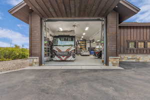 View of parking featuring a garage