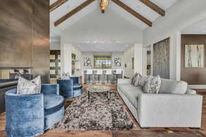 Living area with wood finished floors and recessed lighting