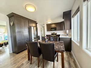 Uodated Dining room featuring wood finished floors