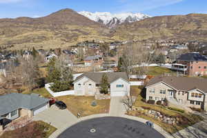 Aerial perspective of suburban area featuring a mountainous background