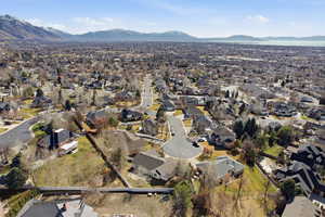 Aerial perspective of suburban area with a mountainous background