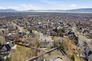 View of property location with mountains and nearby suburban area