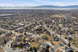 Aerial overview of property's location featuring nearby suburban area