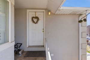 View of exterior entry to ADU with stucco siding