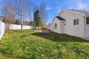 Fenced backyard featuring a patio area