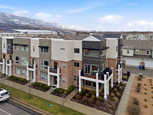 View of property with a mountain view