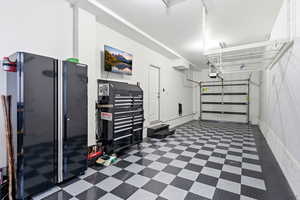 Garage with freestanding refrigerator
