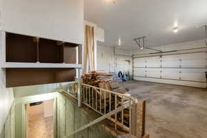 View of garage and basement outside entrance