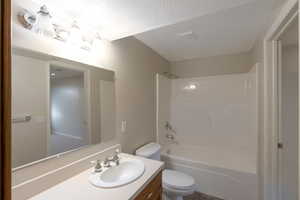 Bathroom featuring vanity and shower / bathtub combination