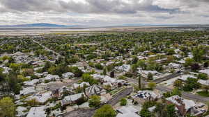 Aerial perspective of suburban area with a mountain backdrop